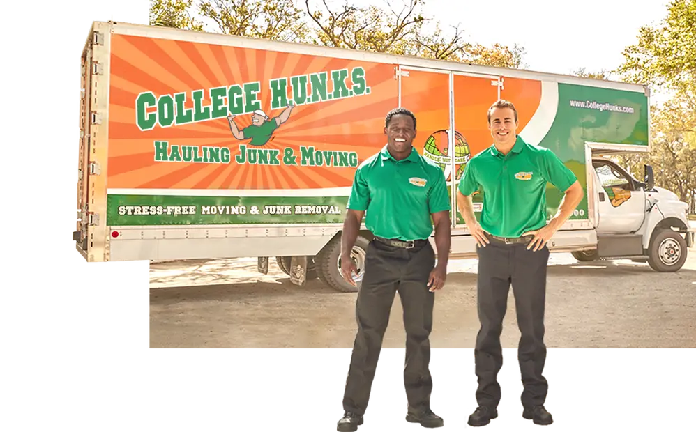 Two College HUNKS stand in front of a College HUNKS Hauling Junk & Moving moving truck